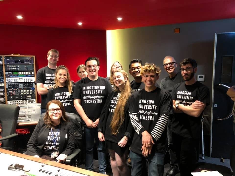 The Kingston University Stylophone Orchestra gathered in the control room in matching t-shirts
