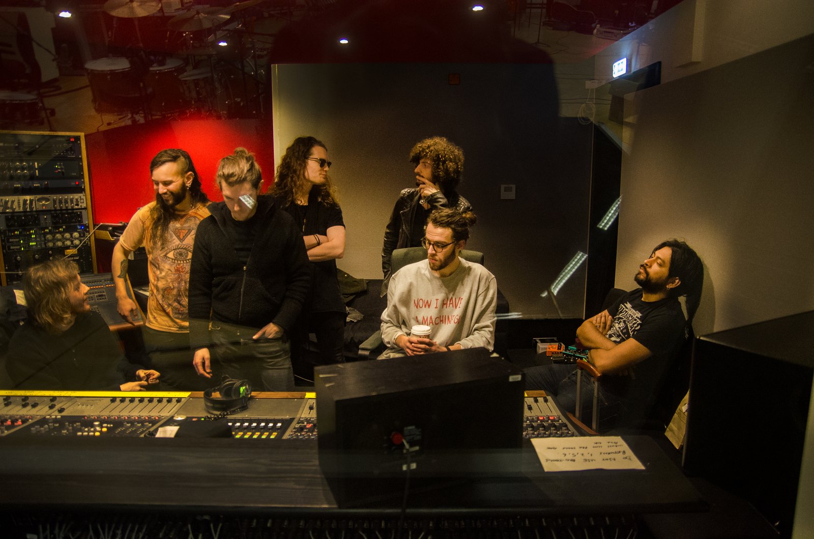 Romances listening to playback in the control room