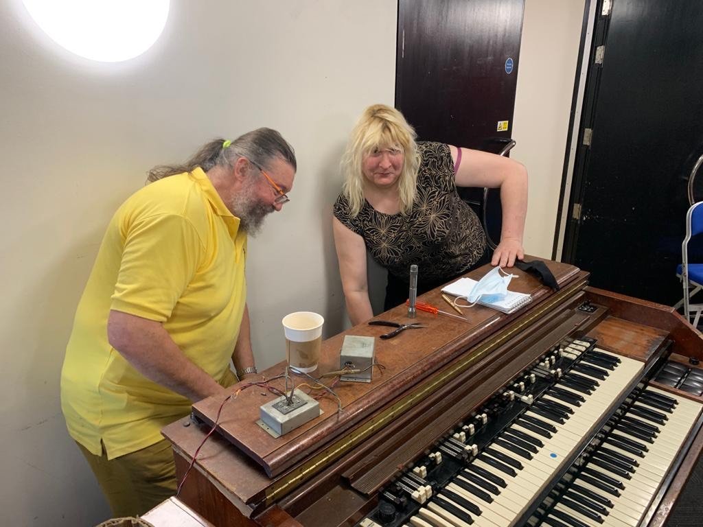 A technician servicing the 1950s Hammond organ