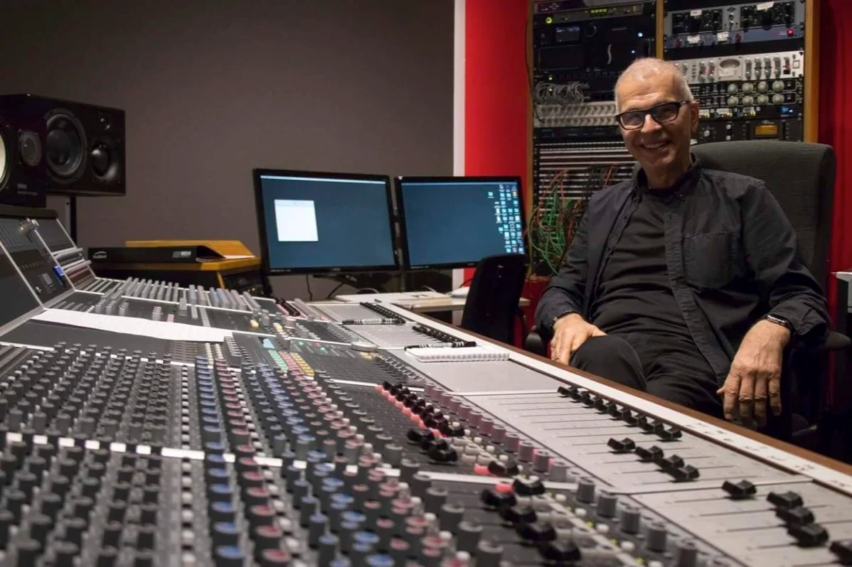 Tony Visconti sat in the control room next to the Audient console, with outboard racks  and patch bay behind him