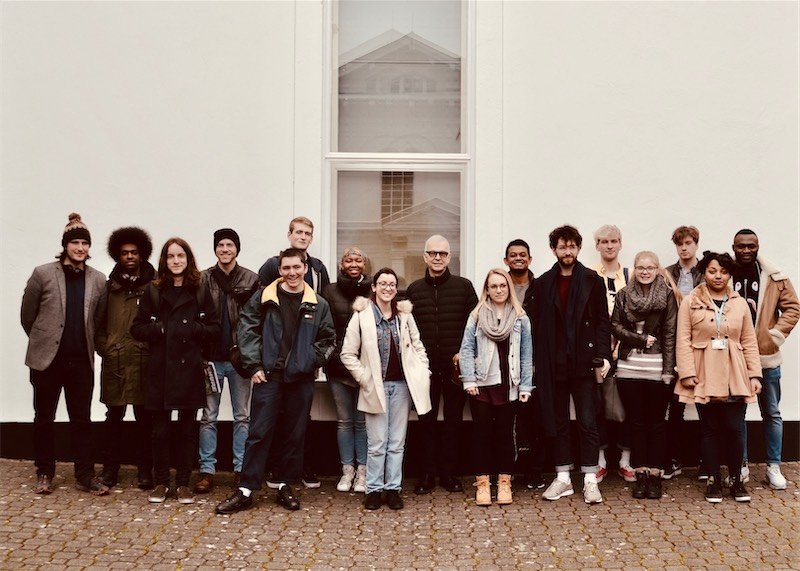 Tony Visconti pictured outside of the studio with music technology students from Kingston University